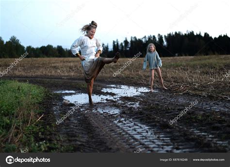 Mom Daughter Dancing Barefoot Splashing Puddle Mud Field Freedom Concept Stock Photo By