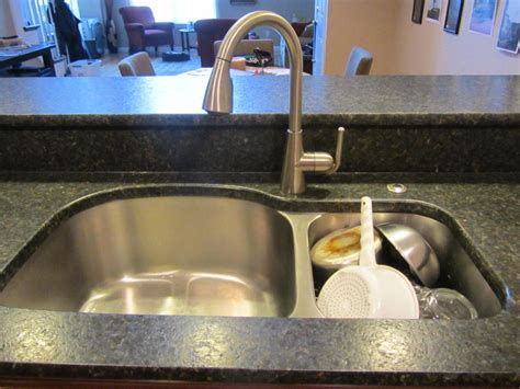 One will hold hot water for rinsing dishes. 8 Kitchen Features to Add to Your Kitchen | Future Expat