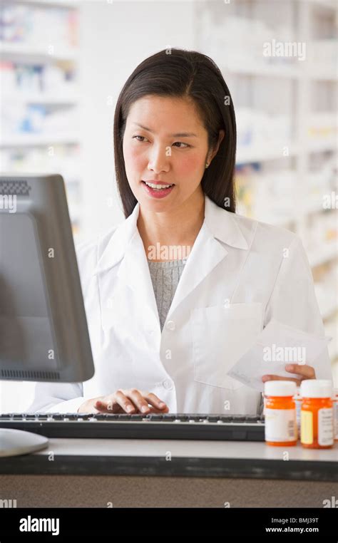 Pharmacist Working On Computer Stock Photo Alamy