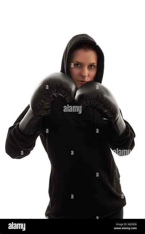 A Portrait Of A Beautiful Young Girl With Boxing Gloves Holding Her