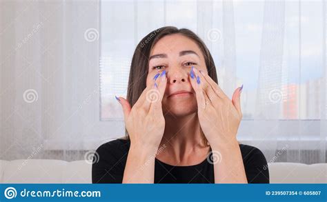 Caucasian Woman Doing Face Massage Along Massage Lines And Points With
