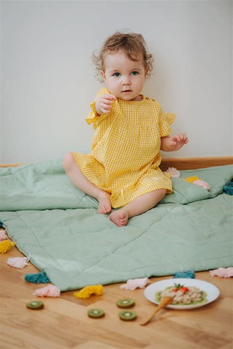 Cute Babe Sitting In The Game Zone Is Ready To Eat Oatmeal Stock Image Image Of Beautiful