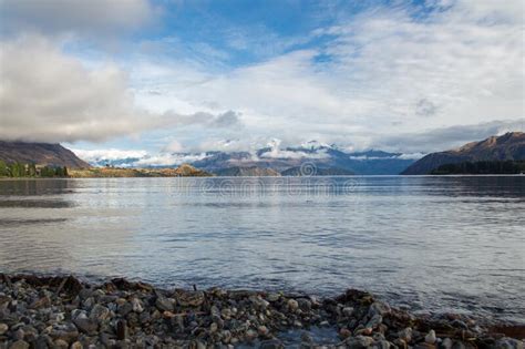 Snow Covered Mountains In Front Lake In Wanaka New Zealand South Island