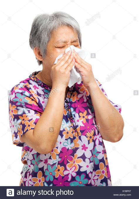 Mature Asian Woman Sneezing Stock Photos And Mature Asian Woman Sneezing