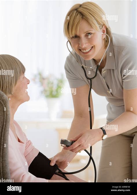 Senior Woman Having Blood Pressure Taken Stock Photo Alamy
