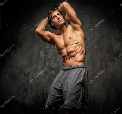Shirtless Muscular Guy Posing In Studio Stock Photo Fxquadro 87074120