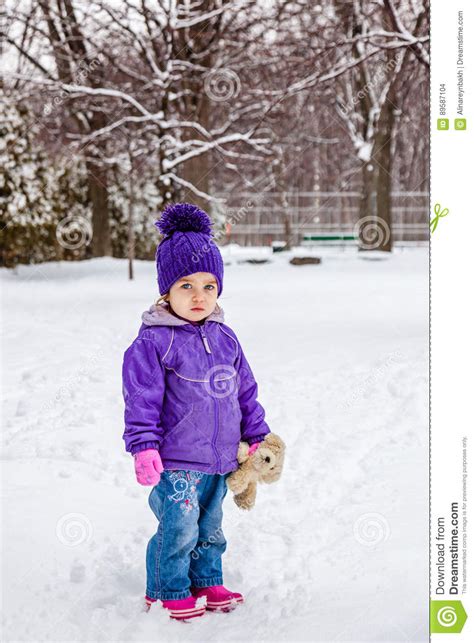 Little Girl Standing Outside In Snow Winter Cold Weather