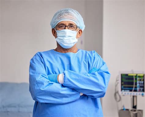 Premium Photo Surgeon Portrait And Man With Arms Crossed In Hospital