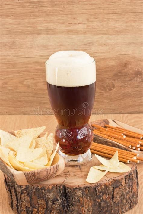 City and country of origin: Glass Cold Dark Beer With Snacks Stock Photo - Image of ...