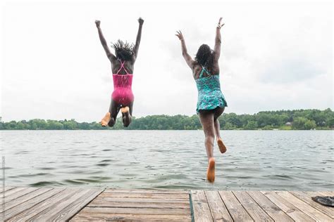 Two Black Friends Jumping In Water By Gabriel Gabi Bucataru Black