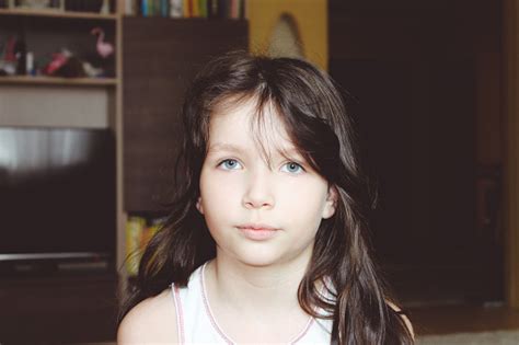 Portrait Of A Beautiful Teenager Girl With Blue Eyes Dark Hair Serious Facial Expression Stock