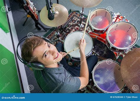 Confident Male Drummer Wearing Headphones While Performing Stock Photo Image Of Playing Music