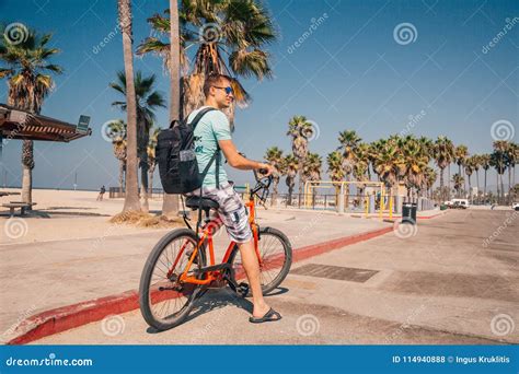 Man Riding A Beach Bike Near Venice Beach In Los Angeles Stock Photo