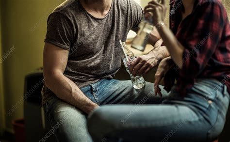 Man And Woman Drinking From Glass Bottles Stock Image F0203811