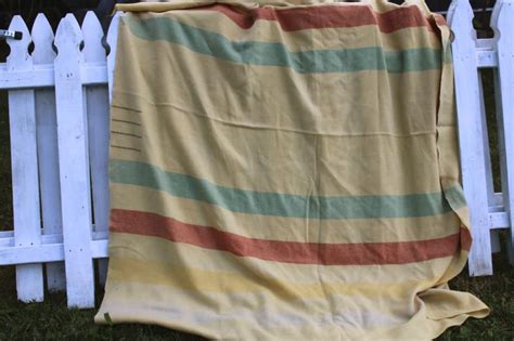 When heading to camp, bring the lumberlander camp blanket along. worn wool camp blanket four point yellow Hudsons Bay ...