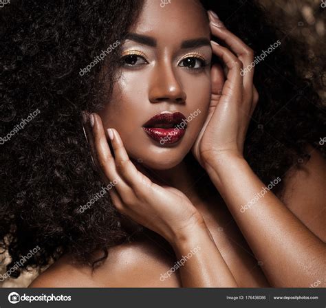 Young Elegant African American Woman With Afro Hair Glamour Makeup Golden Background Stock