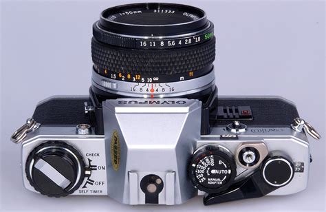 Olympus OM10 chrome with F zuiko 50mm F1.8 lens. - Wide Angle