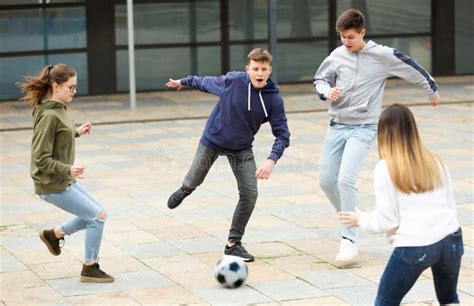 Teenagers Playing Soccer With Ball Outside Stock Photo Image Of