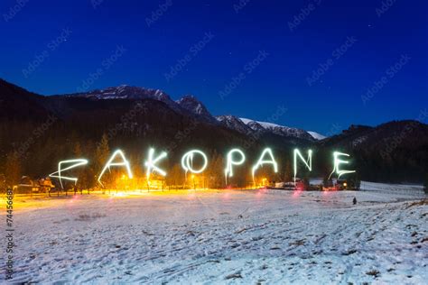 Zakopane Sign Under Tatra Mountains At Night Poland
