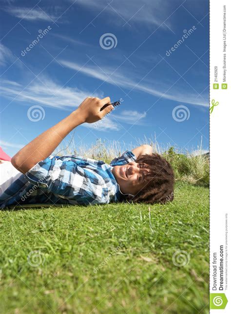 Teenage Boy Relaxing On Phone Stock Photo Image Of Mobile Reading