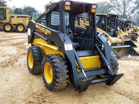 New Holland Ls180 Skid Steer Loader Jm Wood Auction Company Inc