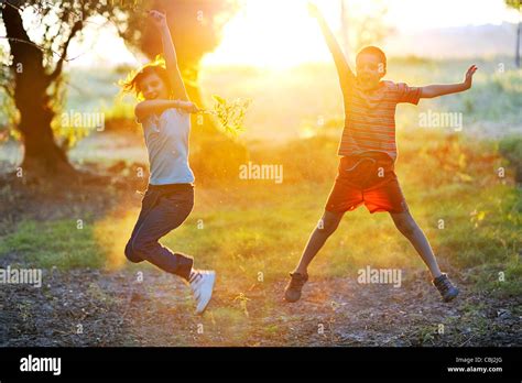Children Play Against The Sun Stock Photo Alamy