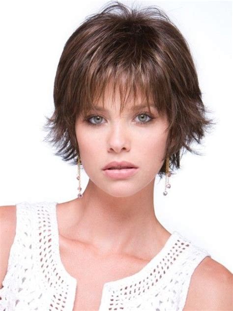 The bangs are smooth and even to frame the model's face. Pin on haircuts