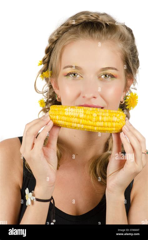 Close Up Portrait Of Young Beauty Woman Eating Corn Cob On A White