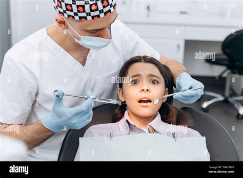 Scared Girl In A Dental Chair Afraid Of The Injection The Dentist