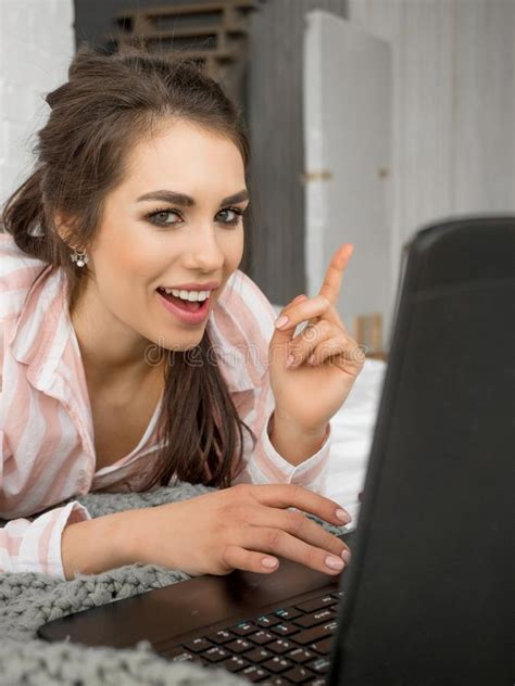 Serious Teenage Girl Laying On Bed And Using Laptop At Home Stock Image Image Of Laptop