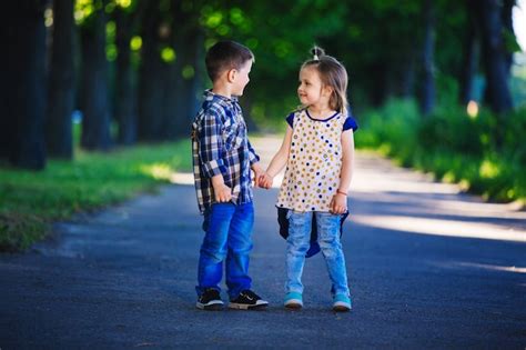 Premium Photo Portrait Of Little Boy And Girl Outdoors