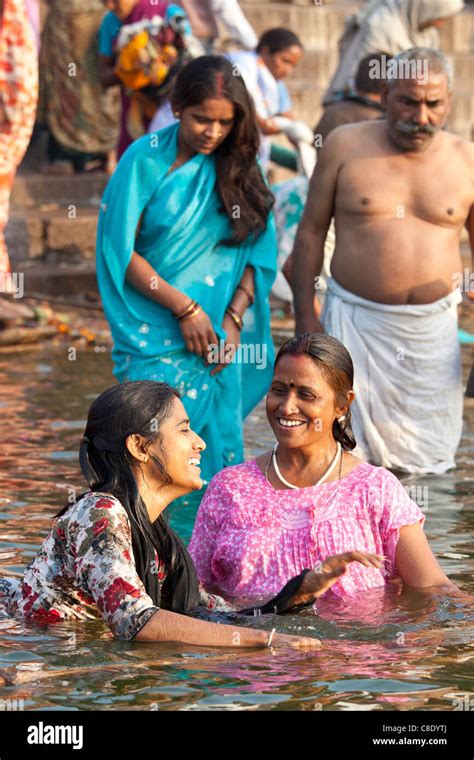 Indian Hindu Pilgrims Bathing In The Ganges River At Dashashwamedh Ghat