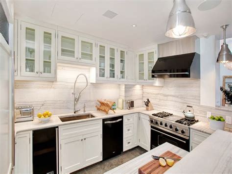The result is a sleek, bright contemporary colorblock kitchen. White Kitchen Cabinets with Black Appliances - Decor Ideas