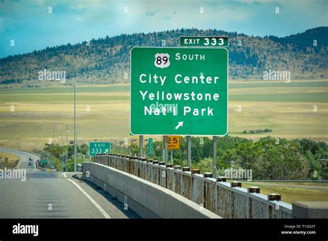 A Green Montana Interstate Exit Sign For South 89 Towards City Center