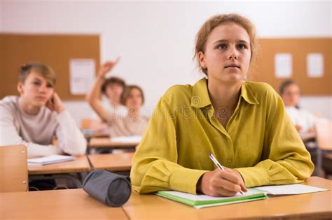 Teenage Students Are Sitting At Their Desks Stock Image Image Of