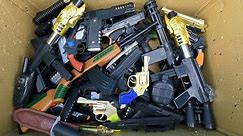 Box of Toy Guns, Realistic Guns That Shoot Beads And Explode Capsules