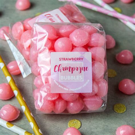 boozy champagne strawberry sweets by holly's lollies 