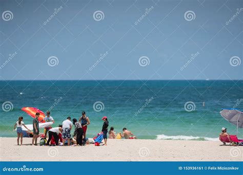 Tourists On Miami Beach Getting Ready For A Day At The Beach Editorial