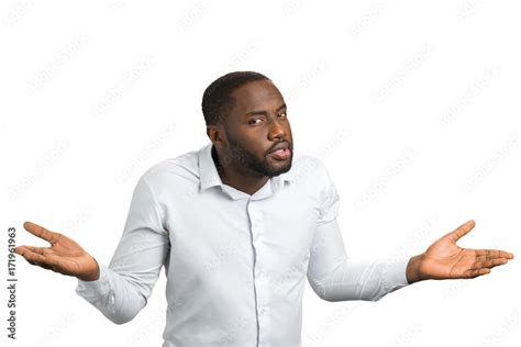 Black Man With Hands In Different Sides Confused Man In White Shirt