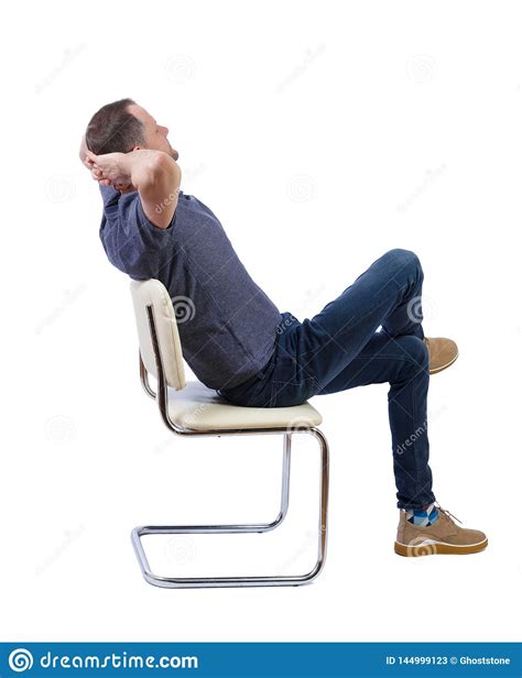Side View Of A Man Sitting On A Chair Stock Image Image