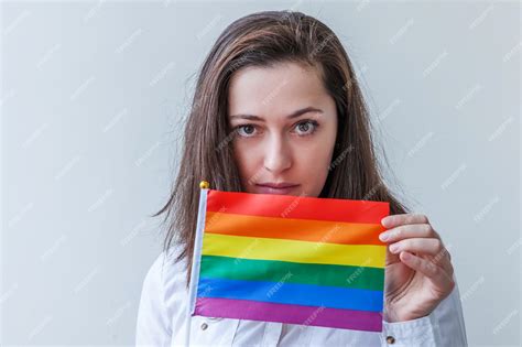 Premium Photo Beautiful Caucasian Lesbian Girl With Lgbt Rainbow Flag Isolated On White Wall