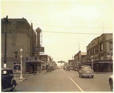 Looking down Tower Ave, note Montgomery Ward and movies playing. Art