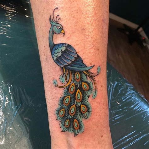 50 best peacock tattoos [2024 inspiration guide]