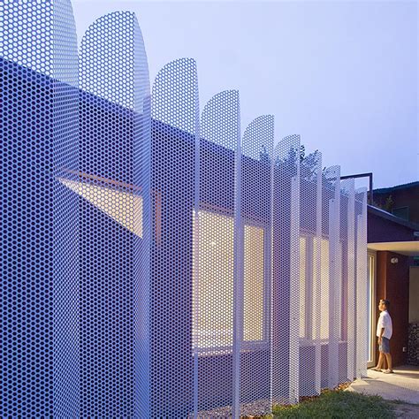 Perforated Wavy Metal Screens Are A Reference To Ancient Persian Arches
