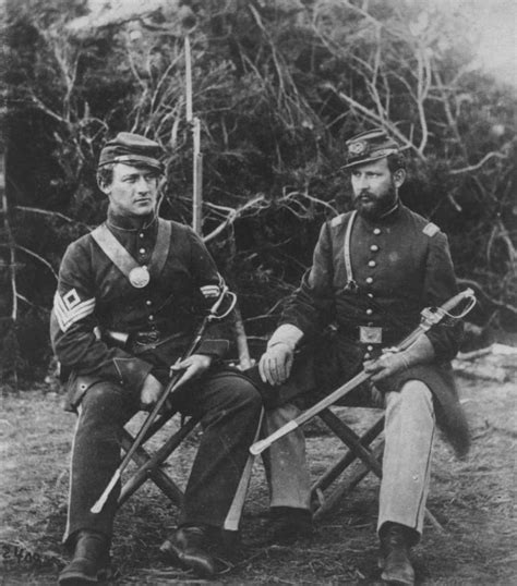 Two Union Soldiers Of The 31st Pennsylvania Regiment Seated With Swords