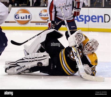 Boston Bruins Goalie Tim Thomas Makes A Save During The First Period Of