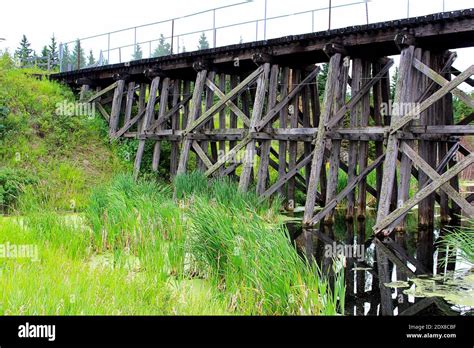 An Old Trestle Railroad Bridge Spanning A Pond Stock Photo Alamy