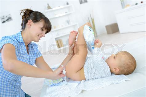 Changing The Babys Diapers Stock Image Colourbox