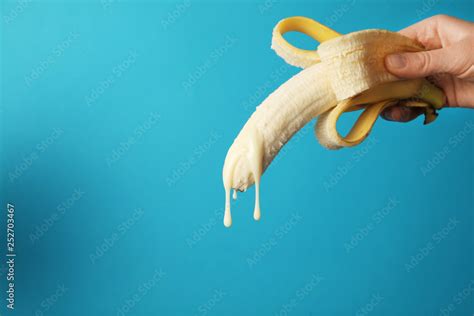 Big Banana And Drops Of Condensed Milk Concept Of Sex Man Ejaculation Sperm And Orgasm Stock