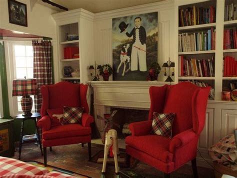 Beautiful red living room chairs were placed in. Colonial Interior | Red chair living room, Living room ...
